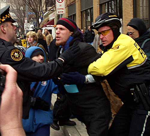 Protester taken back...